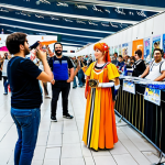 Nikke Community Meetup**

"A vibrant and friendly scene at a local Italian gaming convention. Cosplayers dressed as Goddess of Victory: Nikke characters (fully clothed in appropriate attire) are interacting with fans, browsing merchandise, and participating in gaming contests. Background: Convention hall with Nikke banners and posters. Safe for work, appropriate content, professional photography, perfect anatomy, natural proportions, modest."

**